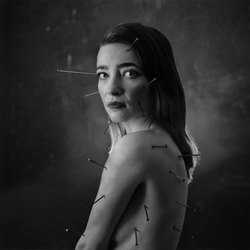 Fine art portrait photography with nails in skin – Jan Skop